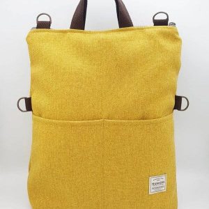 Bolso-mochila amarillo de tapicería reciclada